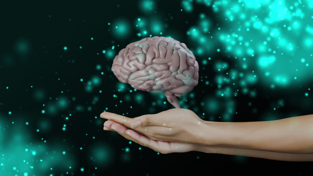 icono del cerebro humano girando sobre las manos cubiertas contra manchas verdes brillantes de luz sobre un fondo negro
