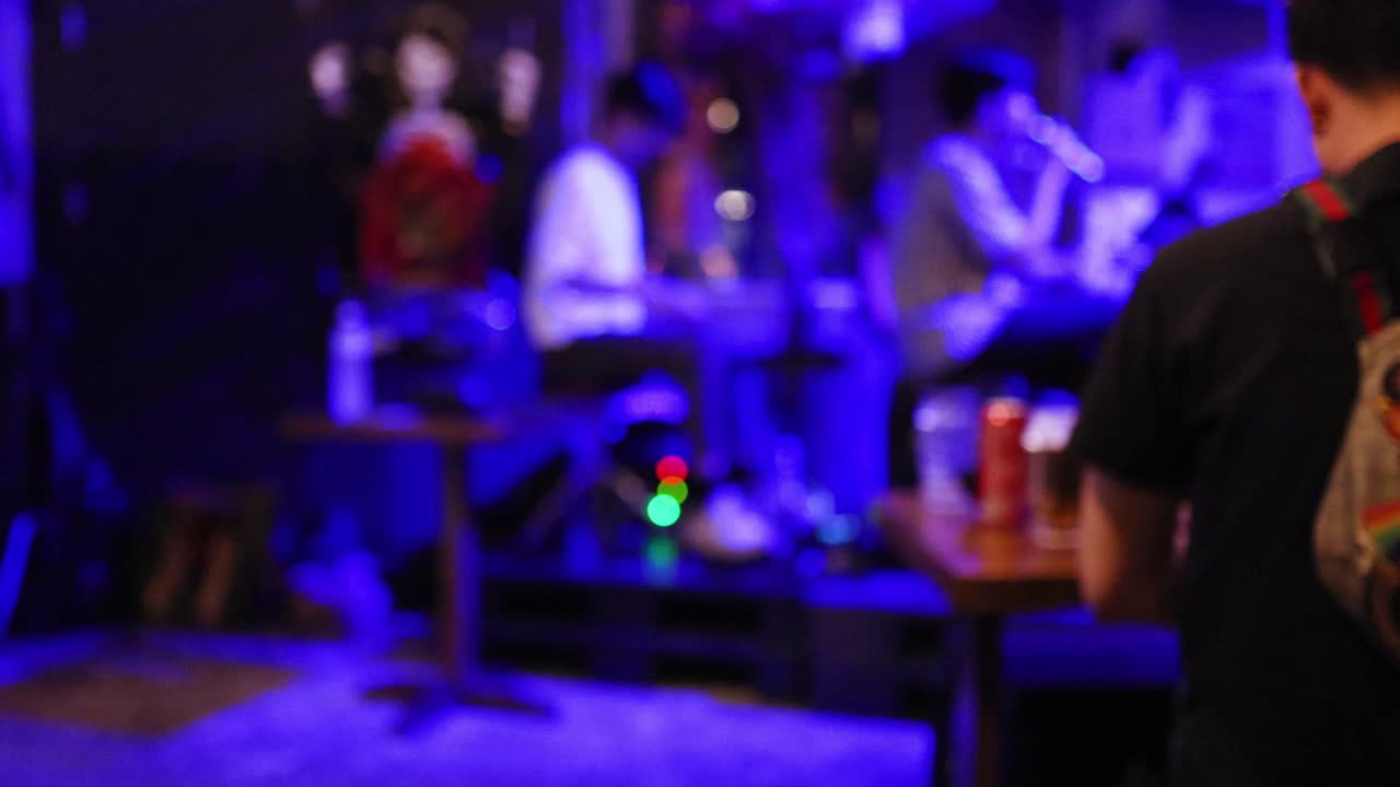 Musicians performing in a vibrant Bangkok venue