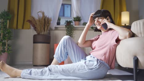 woman talking on the phone with a happy expression.