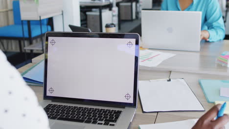 african american business people using laptop with copy space at office, slow motion