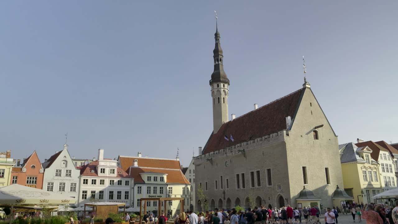 Lively atmosphere at city center square in Tallinn, Estonia on sunny day