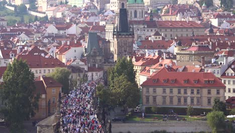 beautiful day establishing shot crowds moving into the old city in prague czech republic