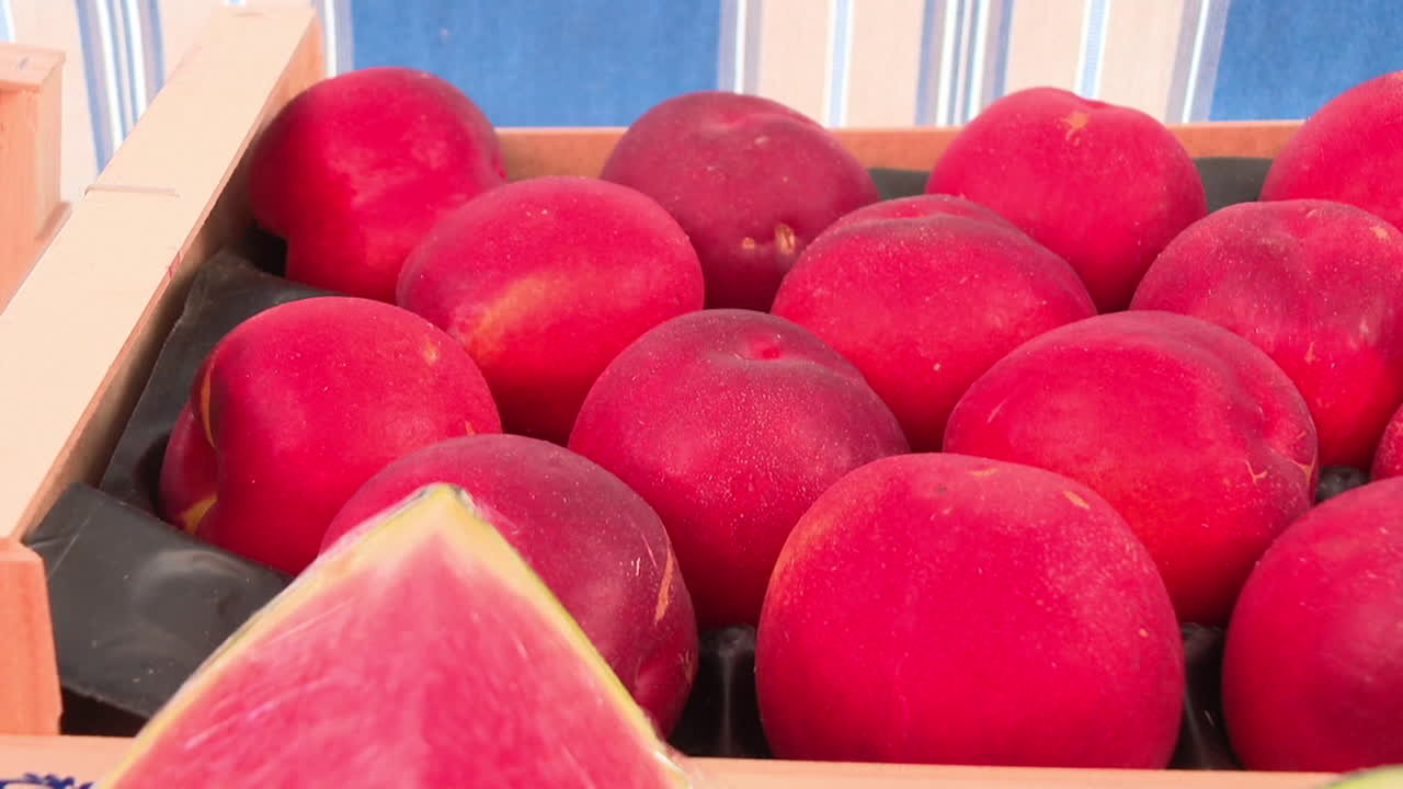 Fresh Red Peaches in Wooden Crate