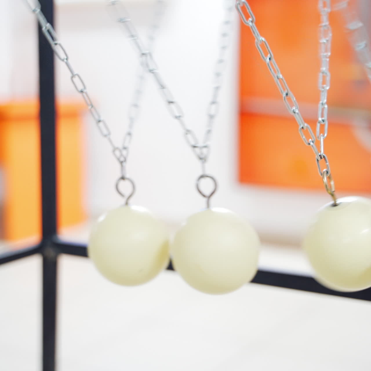 Balancing balls of Newton's cradle. Museum of Science
