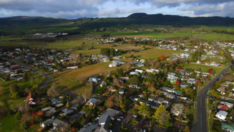 Aerial-shot-of-New-Zealand-Suburb-town-houses-by-a-lake