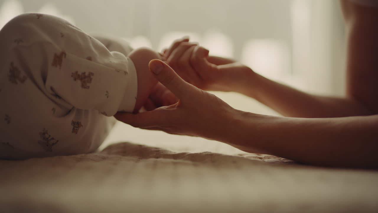 Mother Holding Baby's Feet