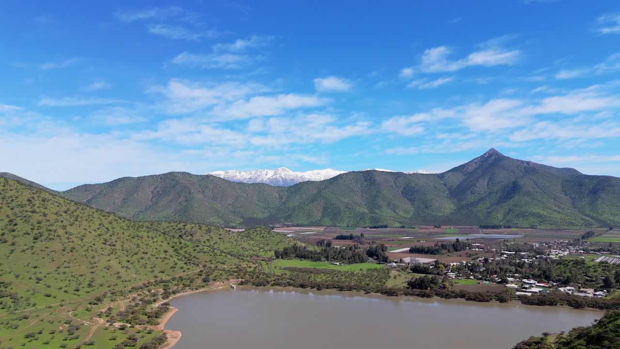 Green hills and the Chada reservoir in the commune of Chada, Paine, Metropolitan Region, Chile