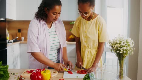mother and daughter cooking together