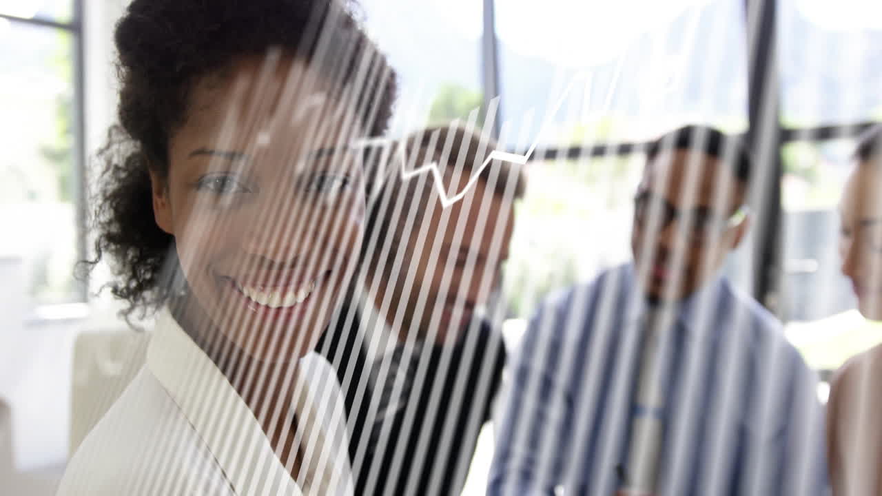 In office, businesswoman smiling with colleagues behind glass wall with white lines
