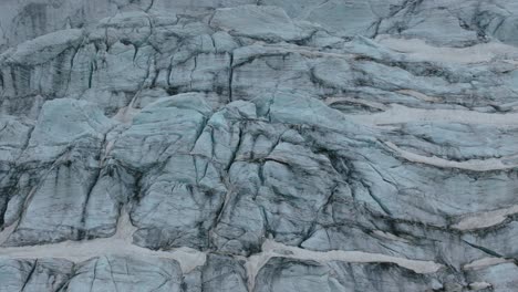 cracked surface of glacier. aerial drone view