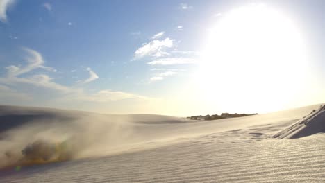 man performing a jump while sand boarding 4k