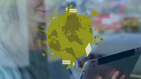 Animation of globe with icons over hands of caucasian woman using tablet