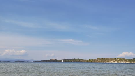 Motion-lapse-timelapse-of-a-tropical-bay-in-Vourvourou-in-Halkidiki,-northern-Greece