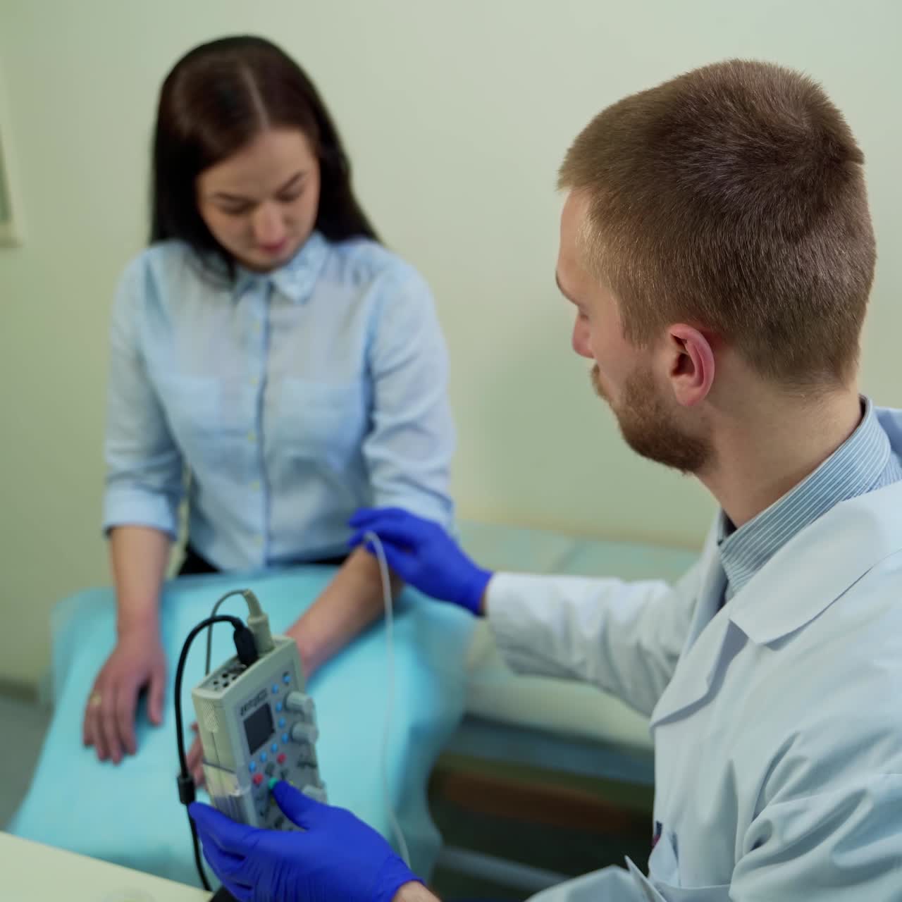 Doctor checks reflex of patient hand. Neurologist testing hand reflex on female patient