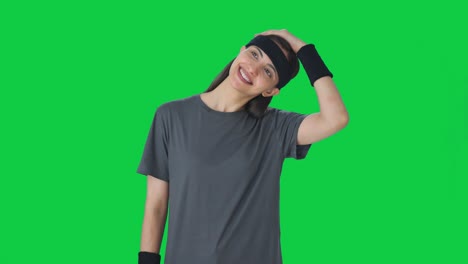 happy indian girl doing neck stretching green screen