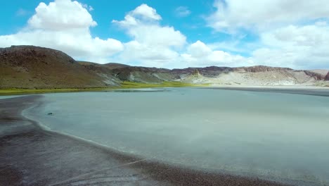 Fly-over-across-salt-lake-and-lagoon-in-the-north-of-Chile,-near-Argentina,-Paso-Jama-region