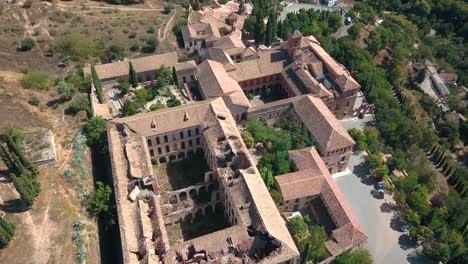 aerial view of an old monastery in ruins