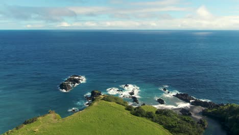 pacific ocean horizon and hawaii island with waioka pond area, aerial view