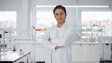 portrait of confident indian scientist standing crossed hands