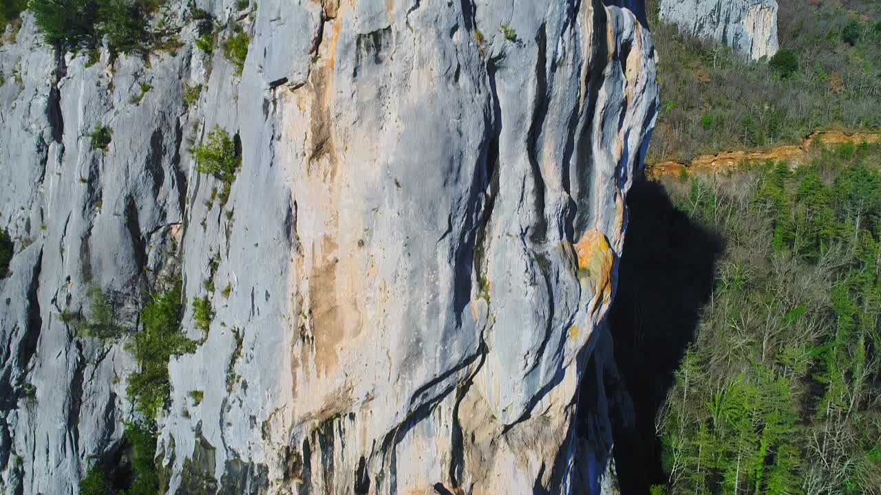 Aerial revealing the ruins of a medieval church over a big rock near Motovun, Croatia