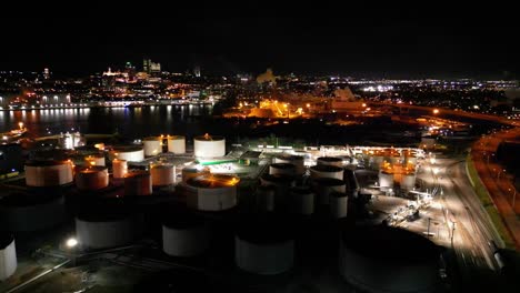 Drone-shot-of-a-city-at-night,-river