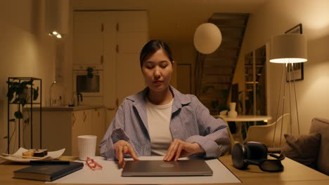 woman working on laptop at night