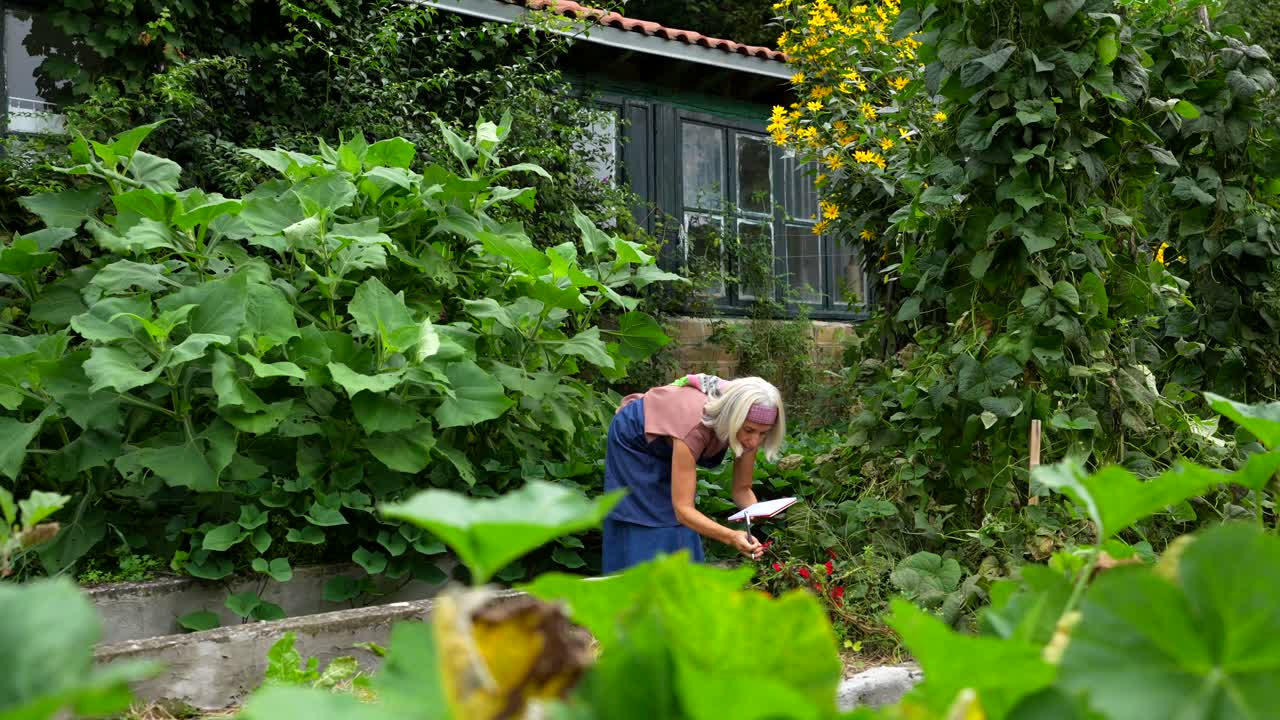 Woman gardening in a lush garden
