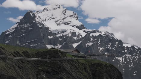 Aerial-tracking-left-establish-Tissot-Cliff-walk-in-Grindelwald-First,-Switzerland