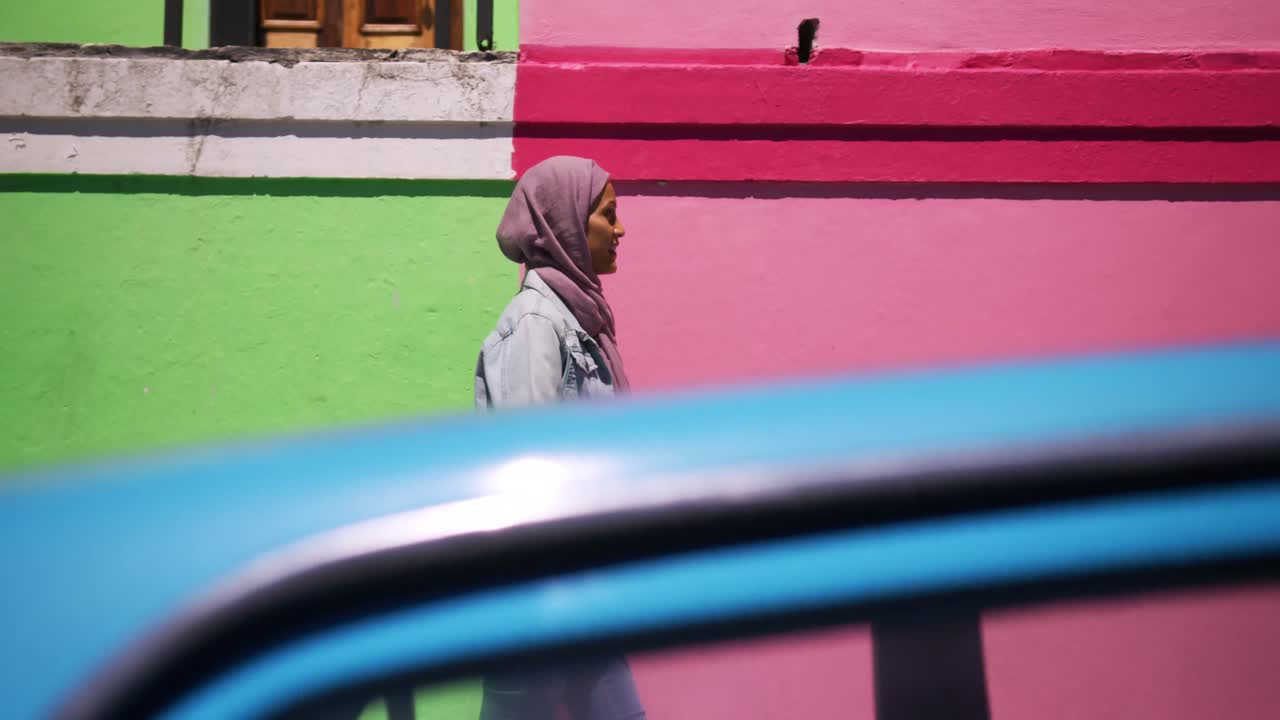 Young woman wearing hijab out and about in the city