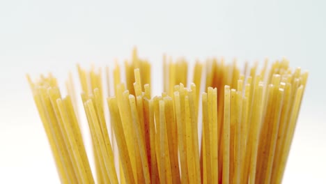 raw spaghetti on white background