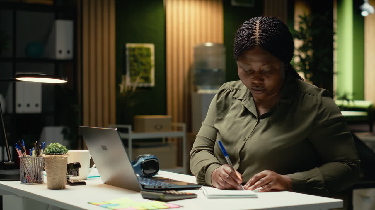 African american woman participates in board meeting video call