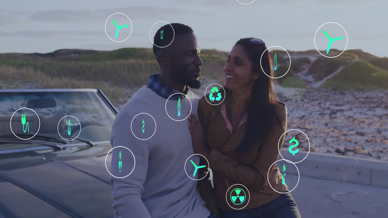 animación de iconos de la ecología sobre una feliz pareja diversa en un viaje por carretera abrazándose en coche