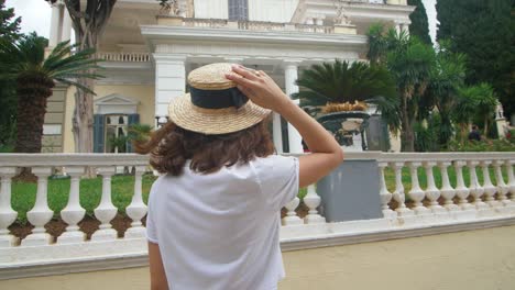 young woman looking architecture on travel. tourist woman walking at summer day