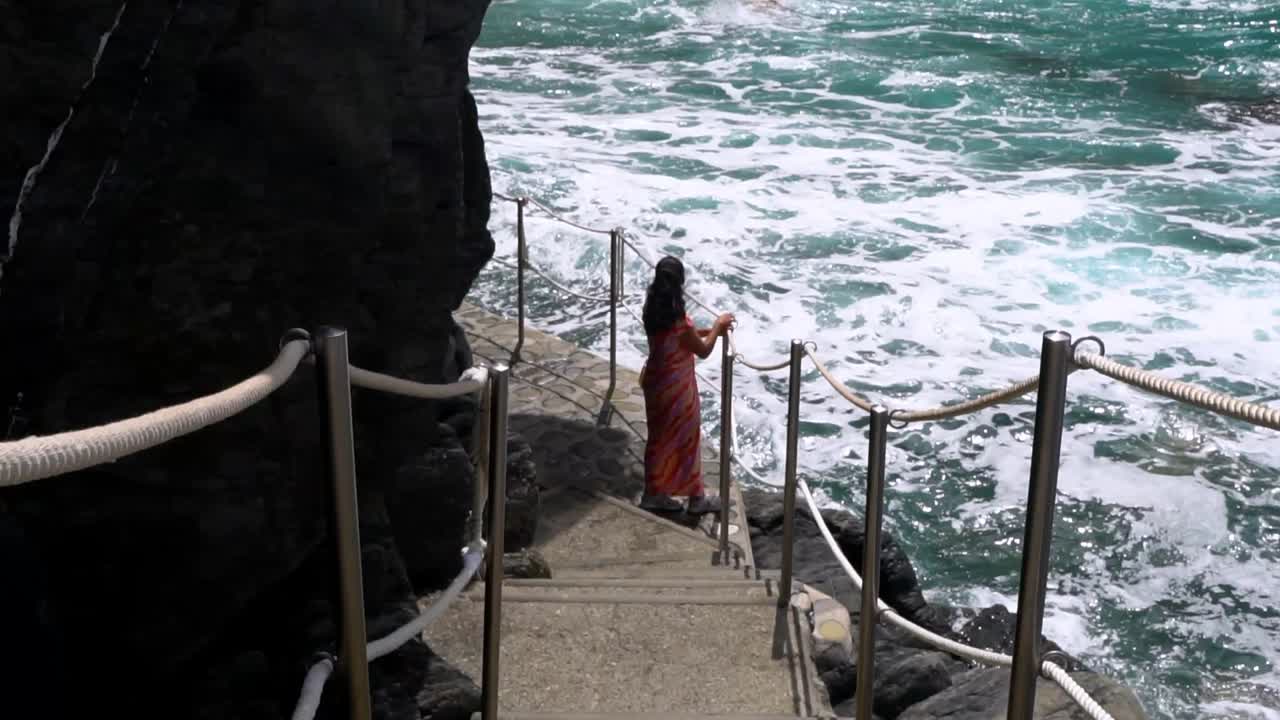 A Woman On A Scenic Coastal Trail With Rugged Shores In The Cinque Terre Region Of Italy. Slow Motion Shot