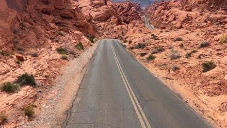 a picturesque and scenic desert road that meanders beautifully through the stunning red rock canyon discover and explore a stunning desert road that winds elegantly through breathtakingly beautiful red rock formations