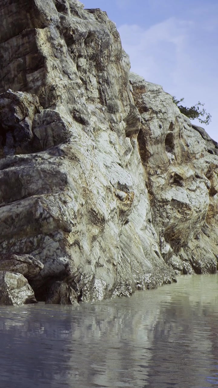Rocce vicino all'acqua su una spiaggia di giorno in una giornata limpida