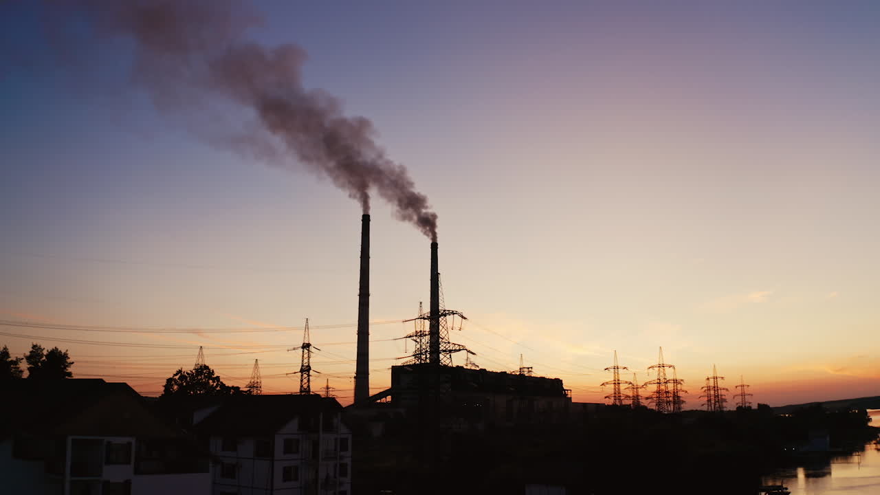Power plant with pipes and smoke. Environmental pollution problem and nature environment