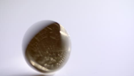 one pound coin spinning and falling