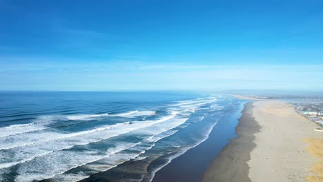 4k aerial drone shot floating over ocean shore at seaside, oregon beach