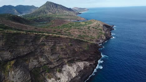 drone shot of a cliffside beach showing views of the coast line