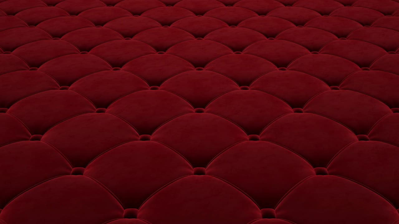 animación 3d del vuelo sobre la superficie de terciopelo acolchado rojo. video en bucle.