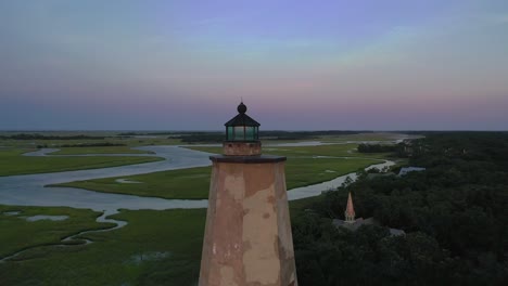 circling around old baldy lighthouse revealing an amazing sunset i bald head island, north carolina