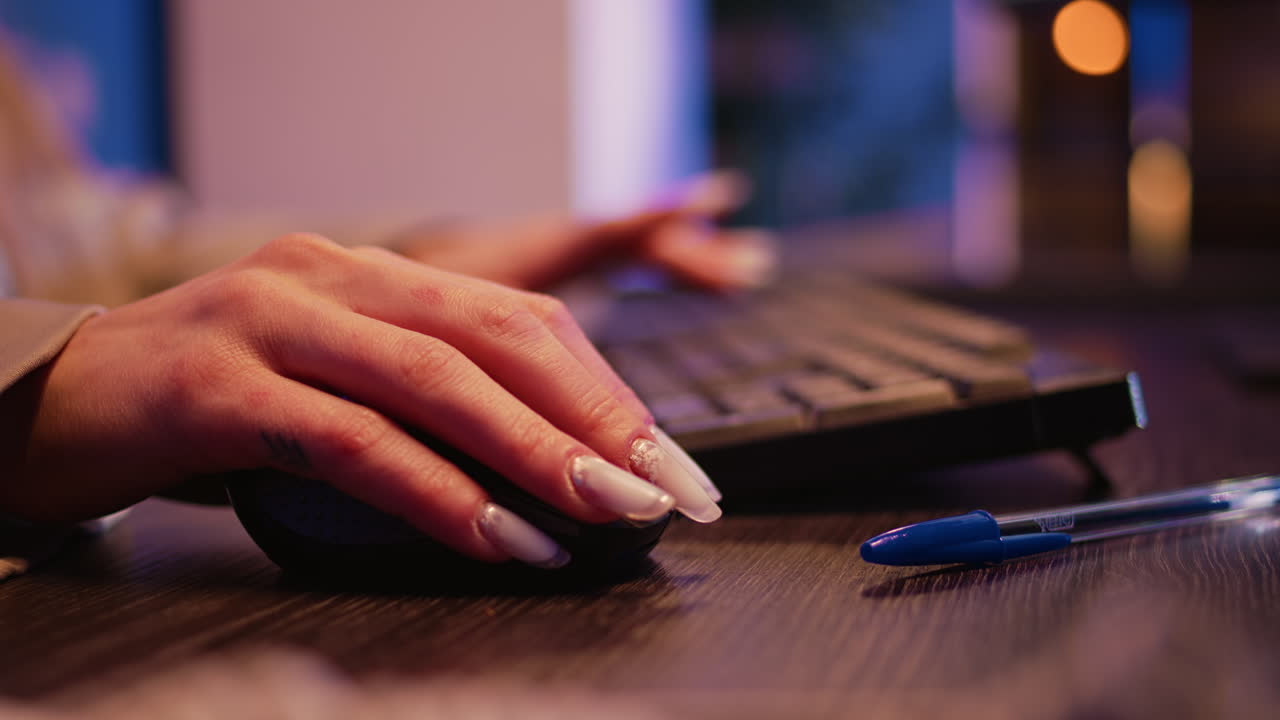 Hands using computer keyboard and mouse