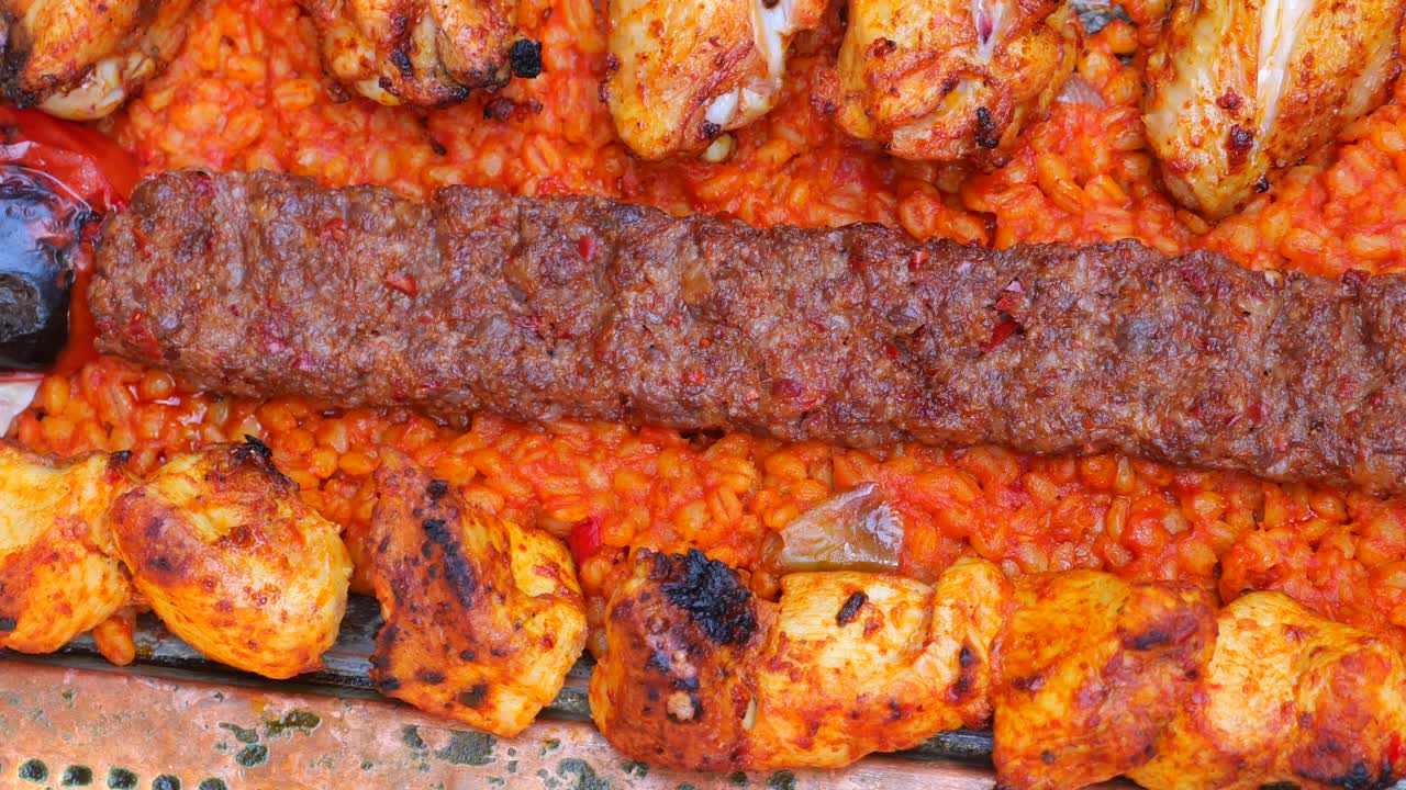 Adana kebab and chicken skewers with rice