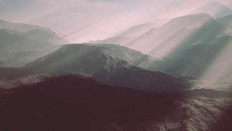alpine chains shrouded in the morning fog