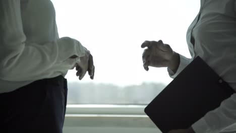 Hands-of-professional-businesswomen-in-formal-wear