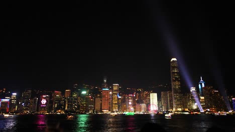 colorful lights illuminate hong kong skyline at night