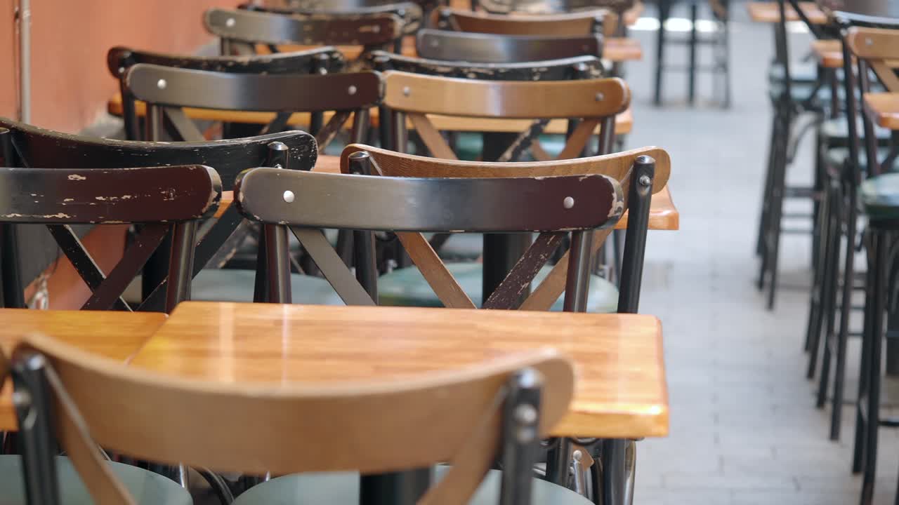 Outdoor restaurant seating with wooden chairs and tables