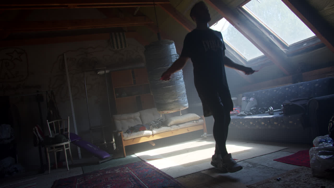 Man Jumping Rope in Attic Home Gym