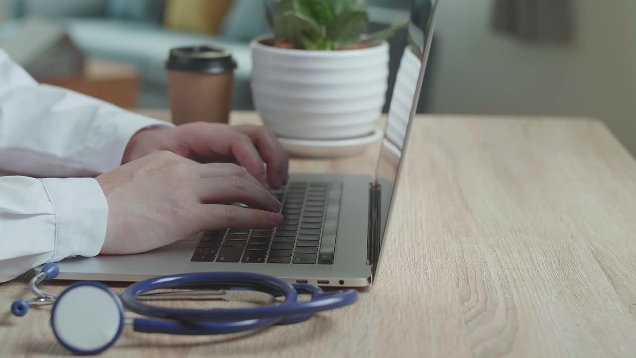 Hands Male Doctor Typing On Laptop Computer At Home Office, Video In 4K
